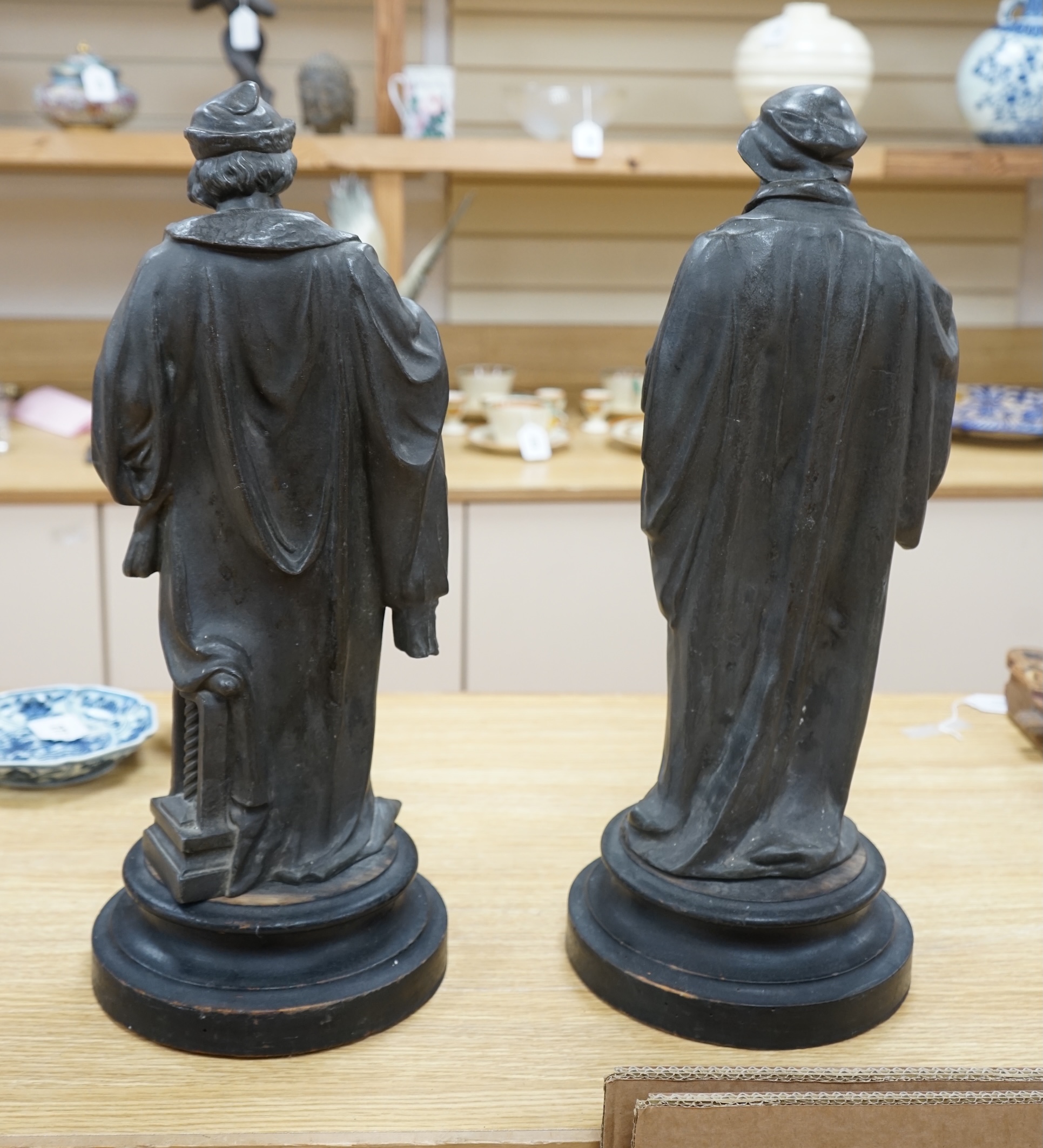 Two bronzed spelter classical figures, possibly Galileo and Leonardo Da Vinci both on turned plinths, 53cm high. Condition - fair, need cleaning plinths need waxing